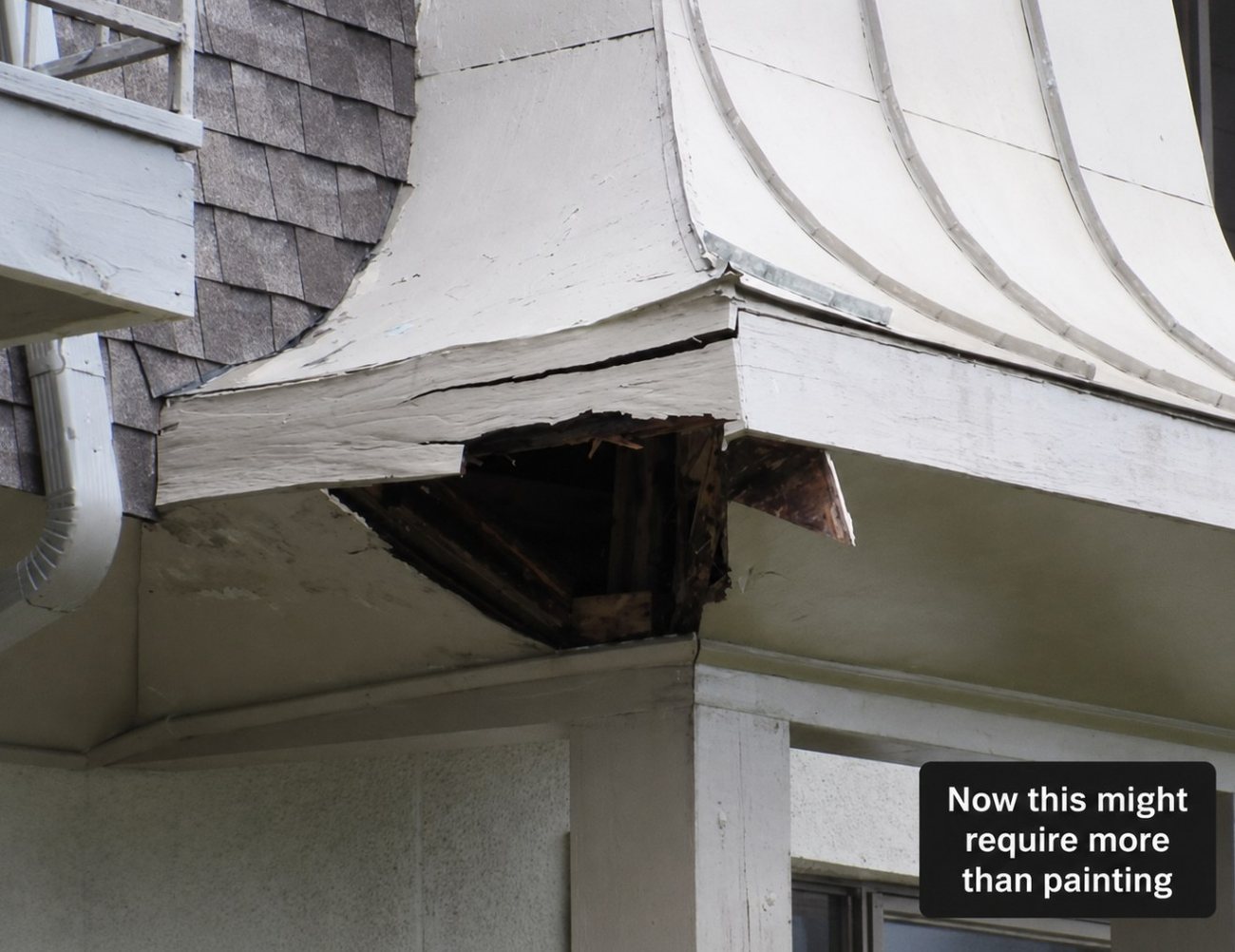 Rotted exterior trim on a building before renovation